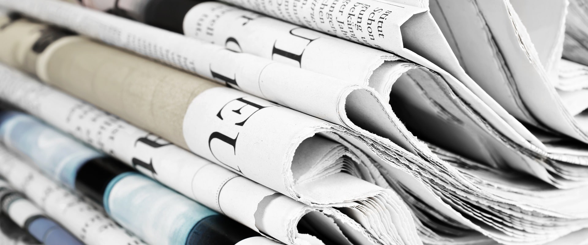 Pile of old newspapers, selective focus