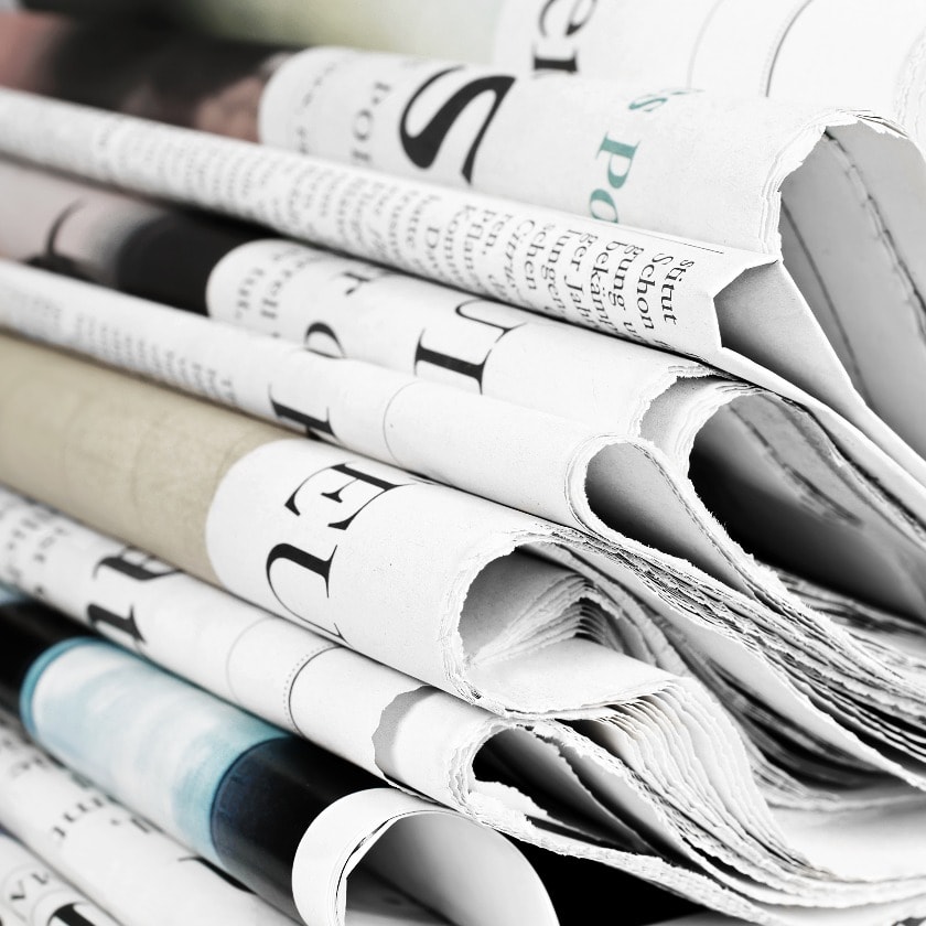 Pile of old newspapers, selective focus