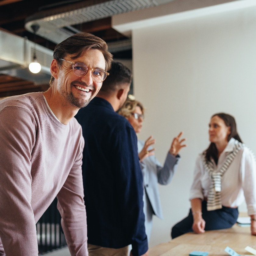 Professional man having a meeting with his team in an office